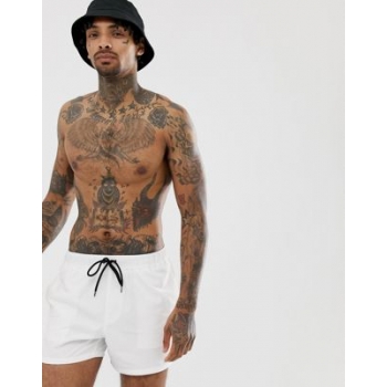 ASOS DESIGN swim shorts in white in short length