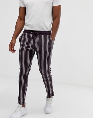 ASOS DESIGN skinny joggers in poly tricot fabric with all over stripes