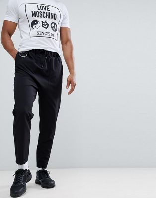 ASOS DESIGN drop crotch trousers in black with metal details