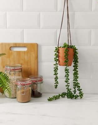 Ian Snow hanging small clay pot with chains