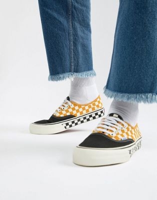 Vans Authentic checkerboard plimsolls in yellow VN0A3MU6U6T1