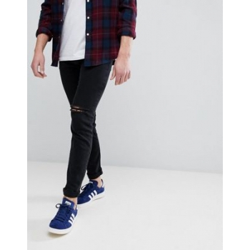 ASOS DESIGN skinny jeans in black with knee rips