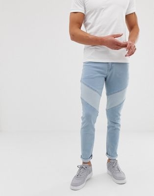 ASOS DESIGN skinny jeans in light wash blue cut and sew panelling