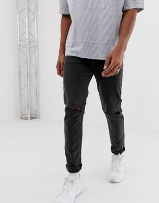 COLLUSION x001 skinny jeans in washed black with rips