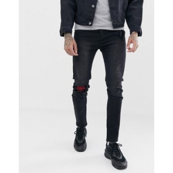 Liquor N Poker skinny jeans in washed black with abrasion check patches