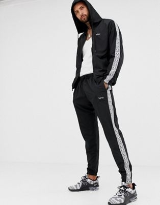 boohooMAN tracksuit with side stripe in black