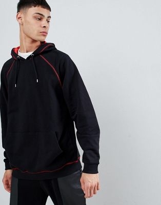 ASOS DESIGN oversized hoodie in red with contrast stitching