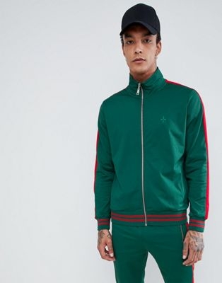 Criminal Damage track jacket in green with red side stripe