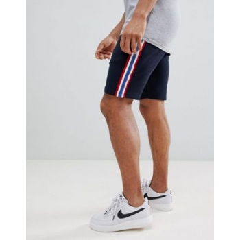 ASOS DESIGN jersey skinny shorts with side stripe in navy