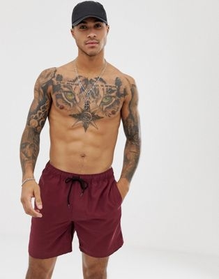 ASOS DESIGN swim shorts in burgundy mid length