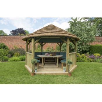 Forest Garden 4m Hexagonal Wooden Garden Gazebo with Thatched Roof - Furnished with Table, Benches and Cushions (Green)